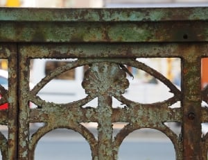 shallow focus photography of rusted gray railing thumbnail