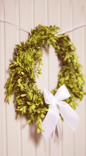 green leaf and white ribbon wreath thumbnail