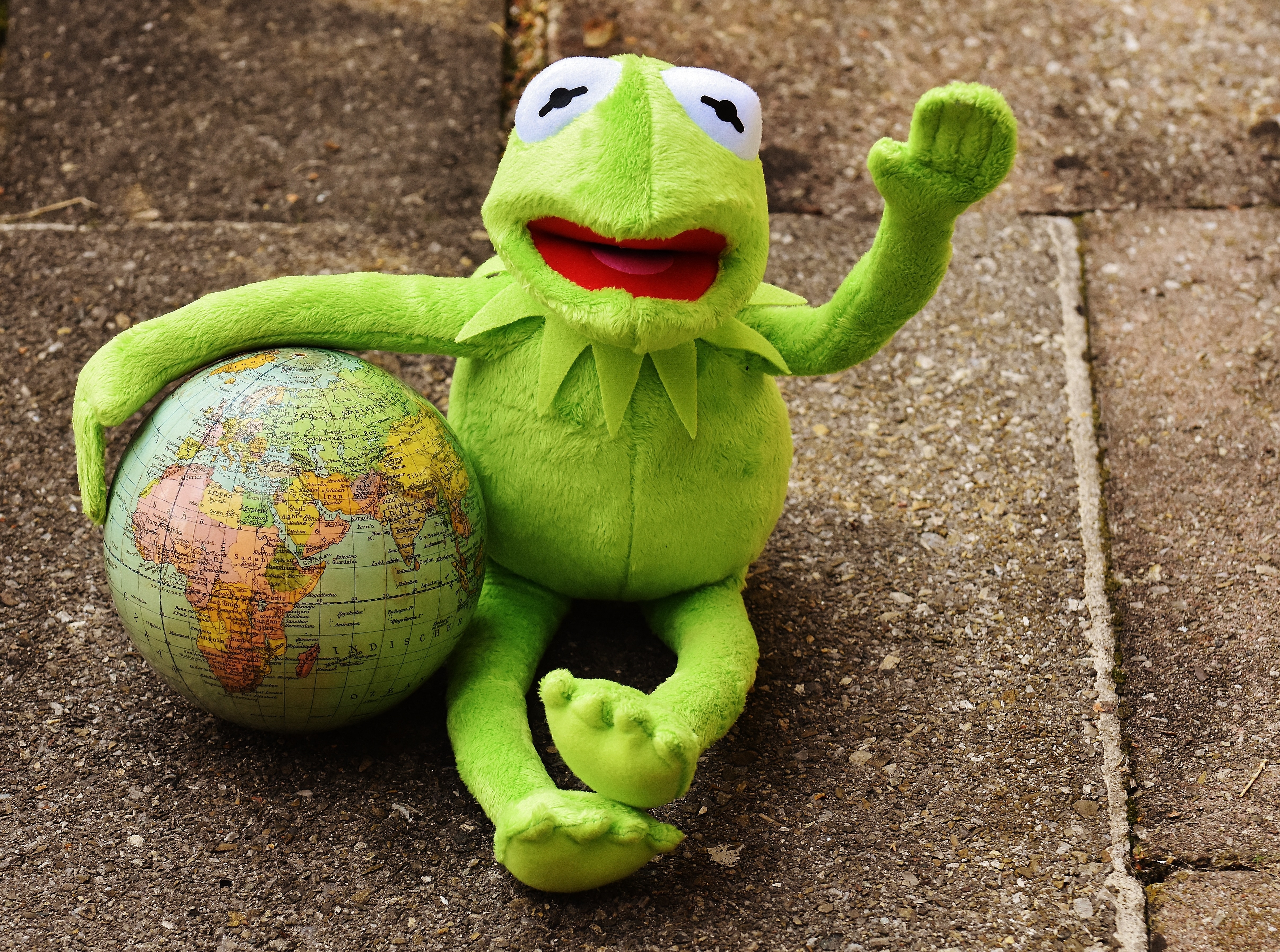 kurmet the frog plush to holding globe