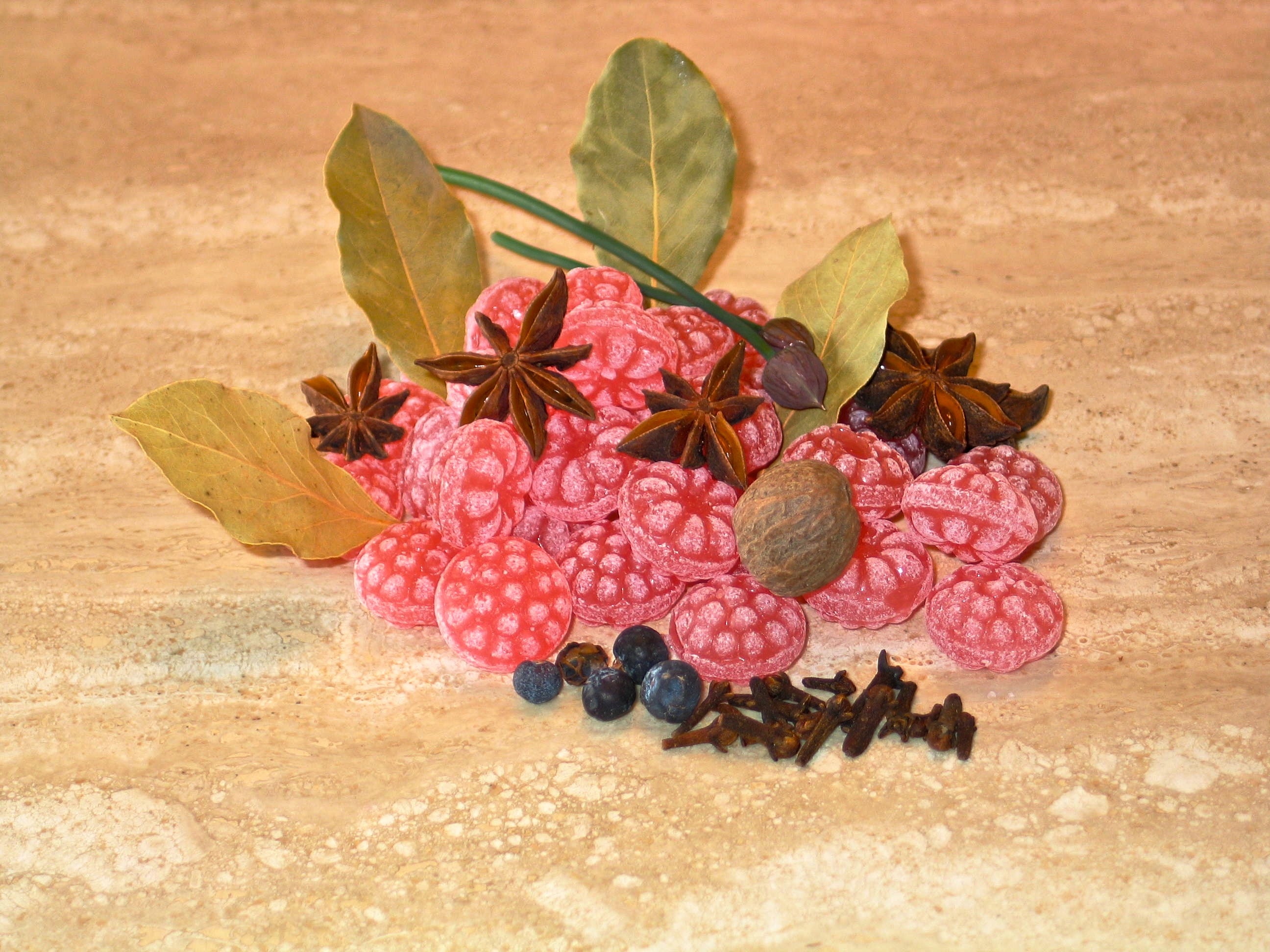 star anise, candies and pink fruits