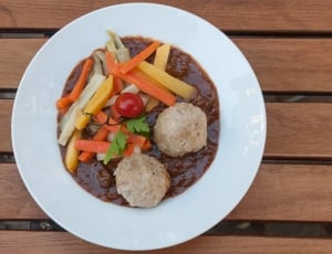 cooked vegetable and 2 meatballs with sauce thumbnail