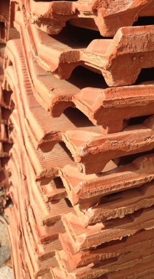 piled brown clay bricks thumbnail