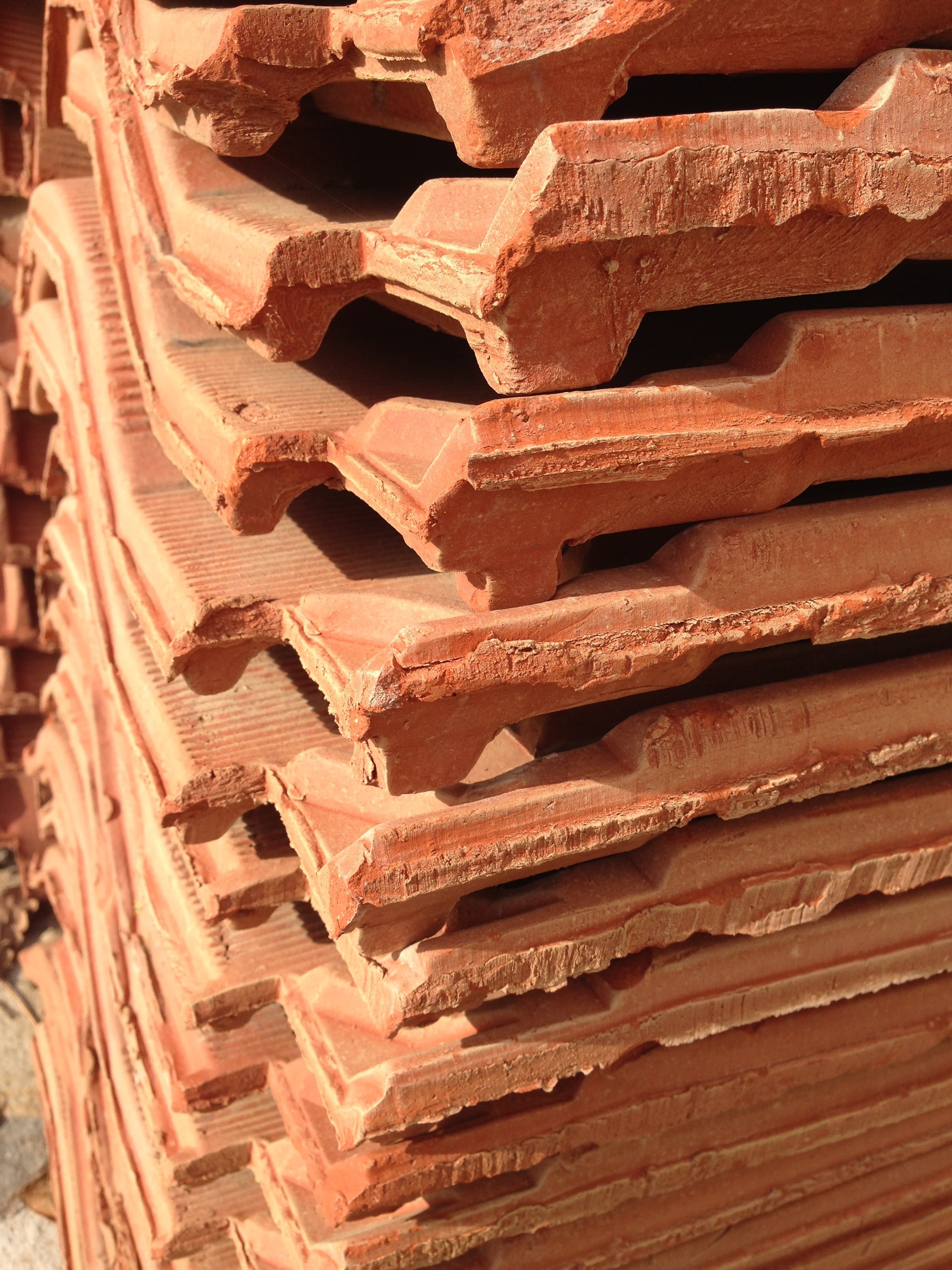 piled brown clay bricks