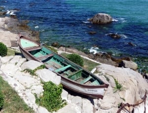 white brown and green wooden canoe thumbnail