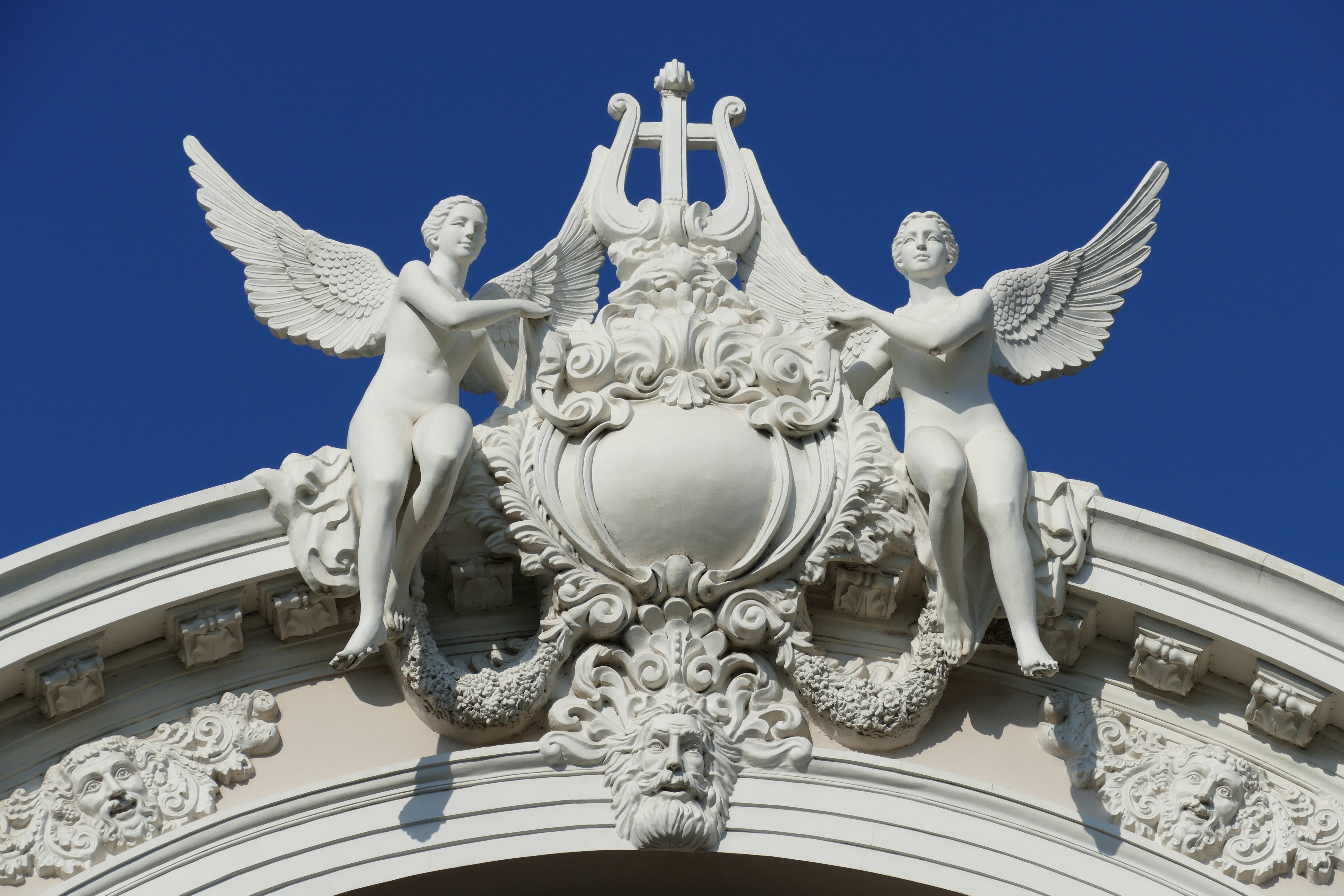 2 white angel roof statues