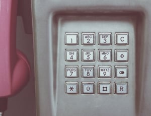 pink and white wall mount telephone thumbnail