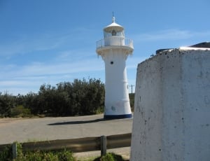 white lighthouse at daytime thumbnail