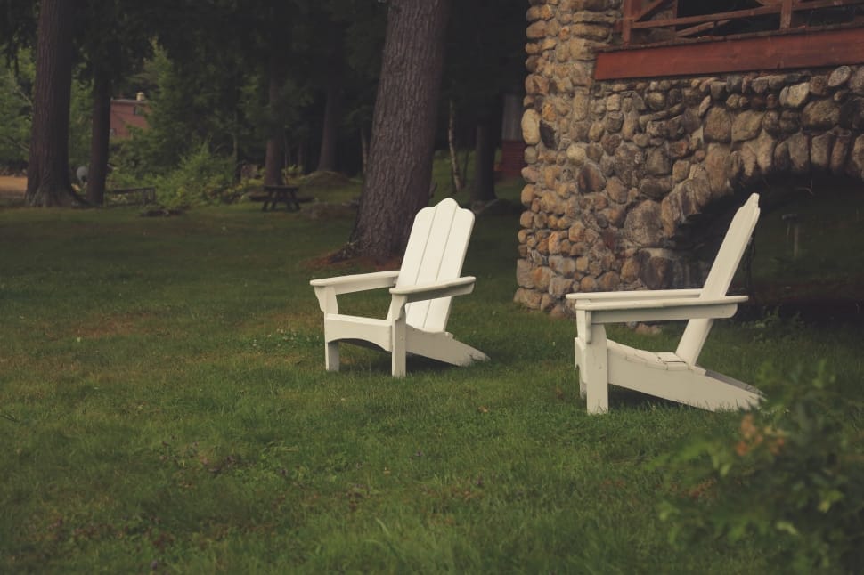 two white wooden adirondack chairs preview