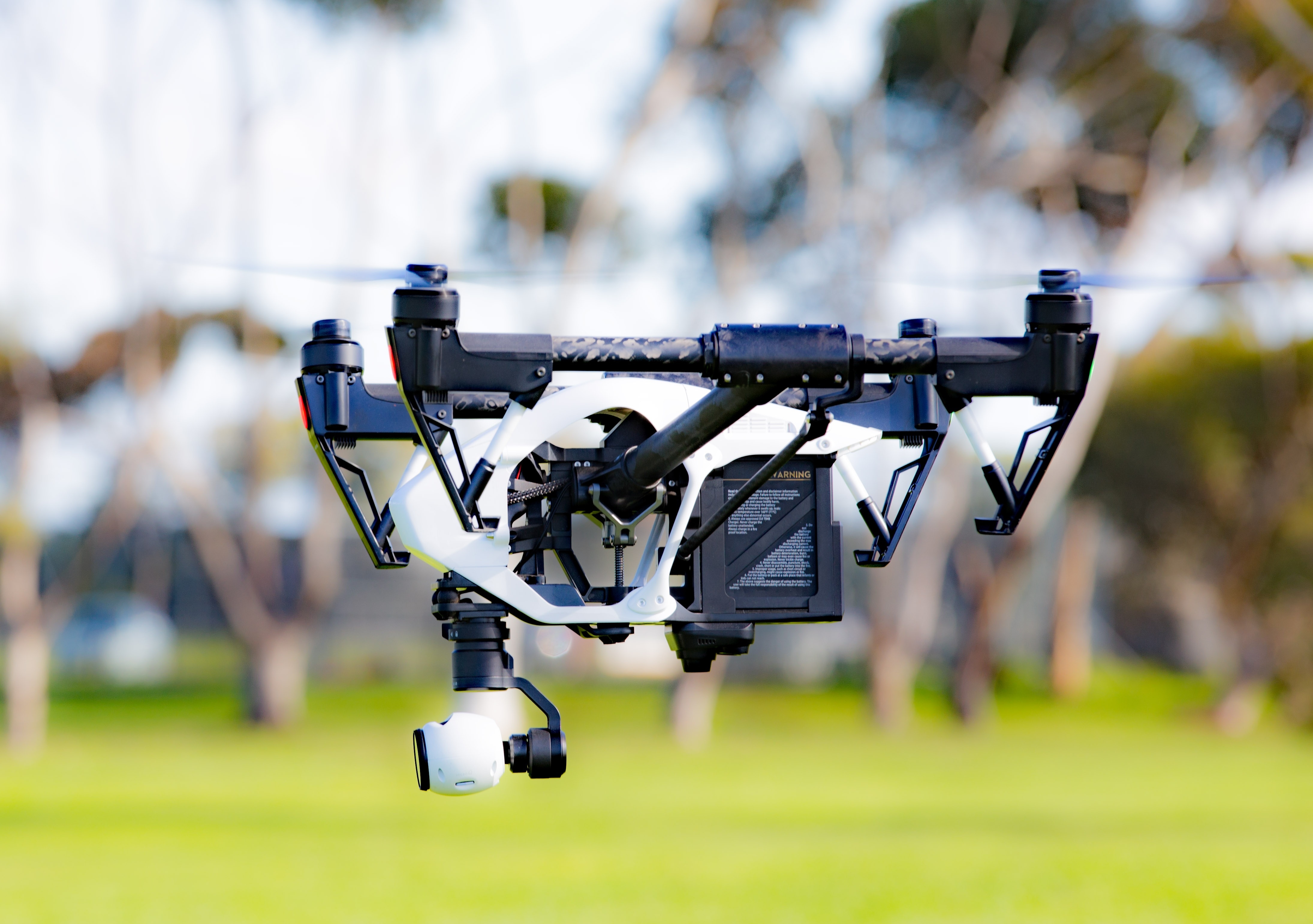 black and white rc quadcopter during daytime