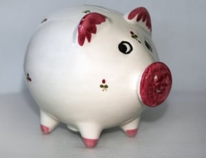 showing red-and-white ceramic pig figurine thumbnail