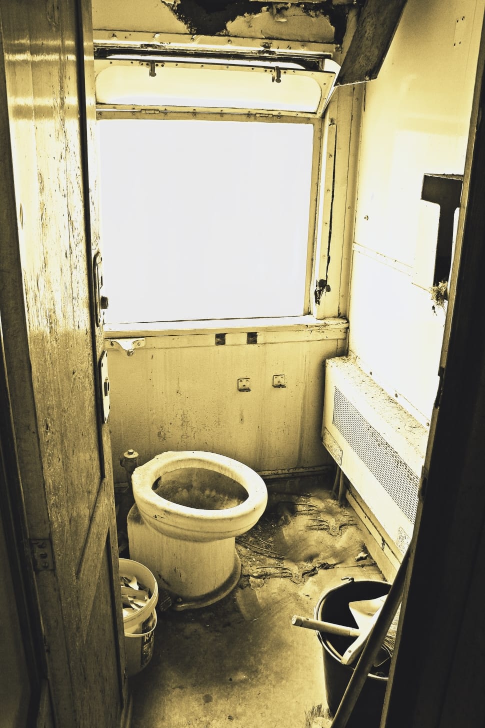 white ceramic toilet bowl inside the rv trailer preview