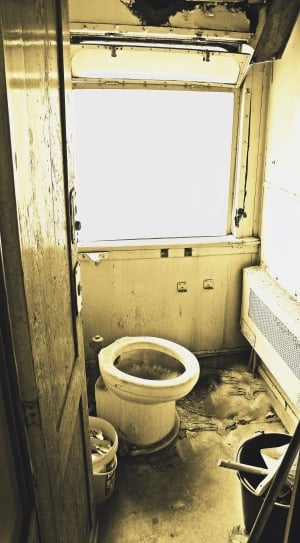 white ceramic toilet bowl inside the rv trailer thumbnail