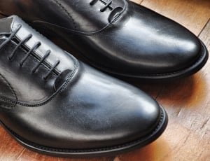 pair of black leather dress shoes thumbnail