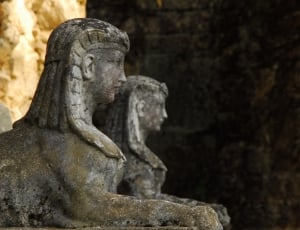 photography of two concrete woman statues thumbnail