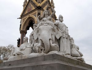 woman riding elephant grey concrete statue thumbnail