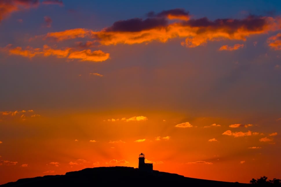 silhouette photo of lighthouse during sunset preview