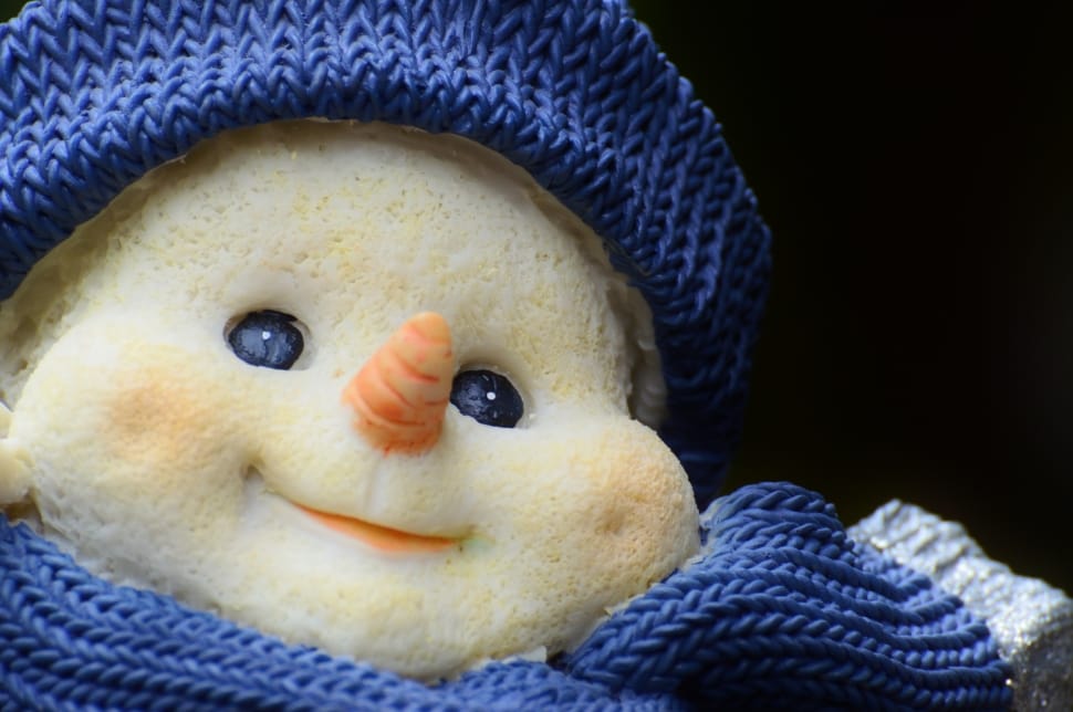white snowman ceramic figurine in blue crochet costume preview