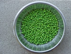 stainless steel round bowl with green peas thumbnail
