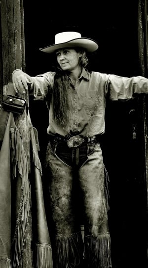 grayscale photography of cowgirl thumbnail