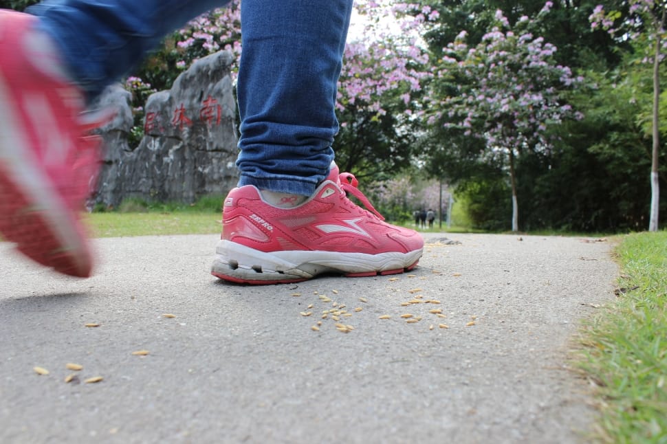 red low top sneakers and blue jeans preview