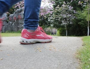 red low top sneakers and blue jeans thumbnail