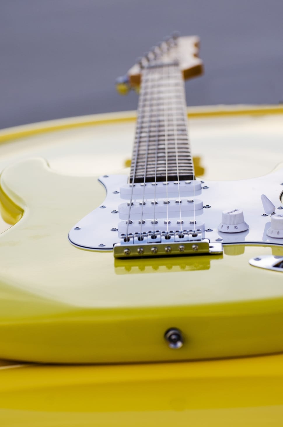 yellow and white electric lead guitar preview