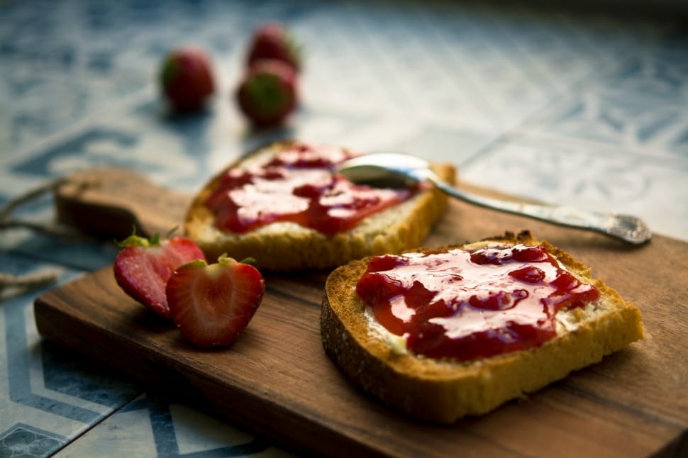 Strawberry jam spread on bread slice preview