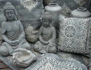 2 gray concrete buddha figurines thumbnail