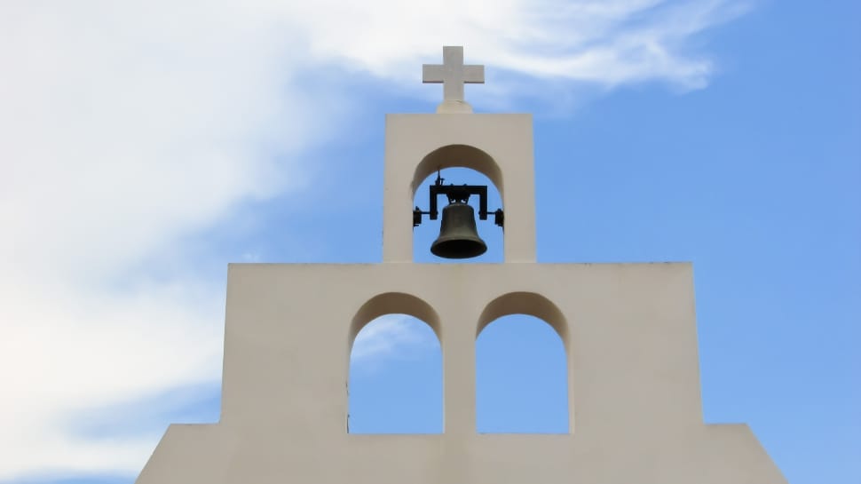 white concrete cathedral cross with bell preview