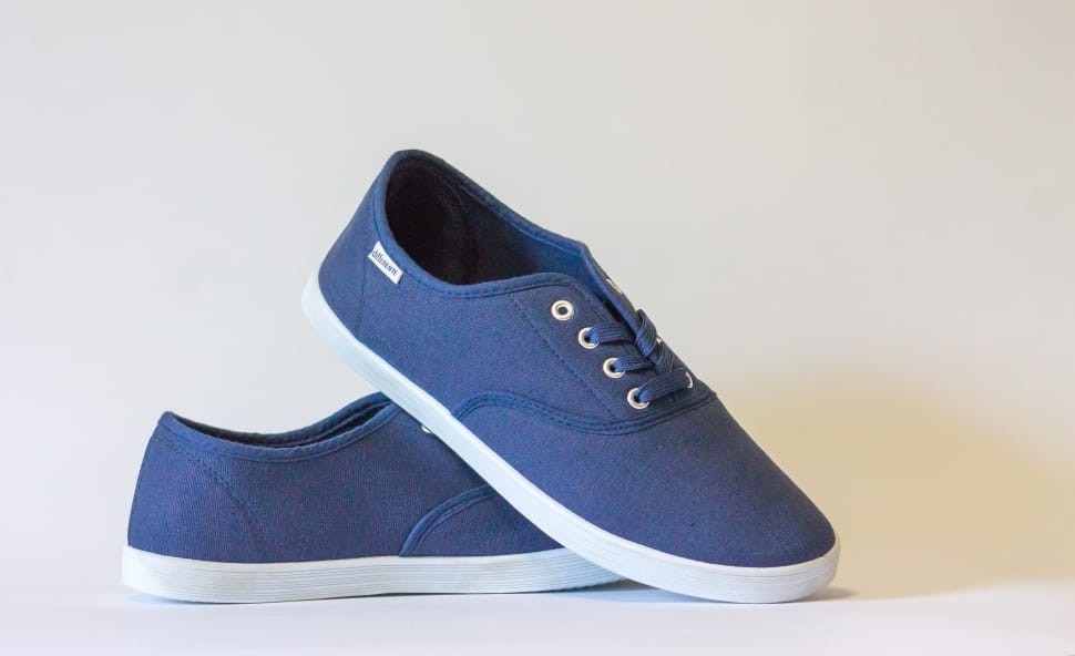 pair of blue and white low top sneakers preview