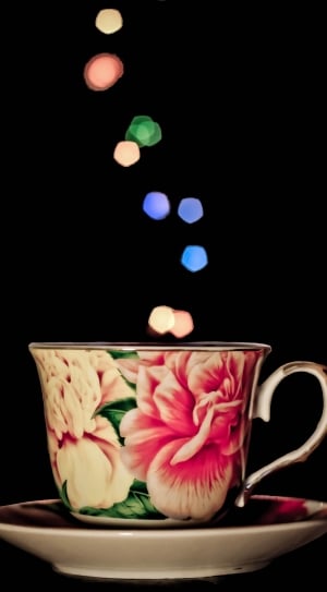 white pink and black ceramic teacup thumbnail