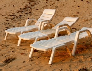 three white sun lounge chairs thumbnail
