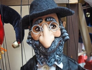 man wearing black hat puppety thumbnail