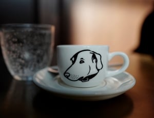 white ceramic plate and cups printed dog on top of the table thumbnail