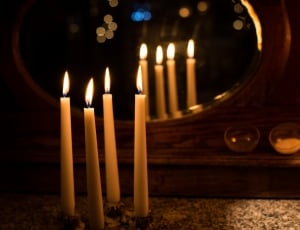 four lighted candles thumbnail