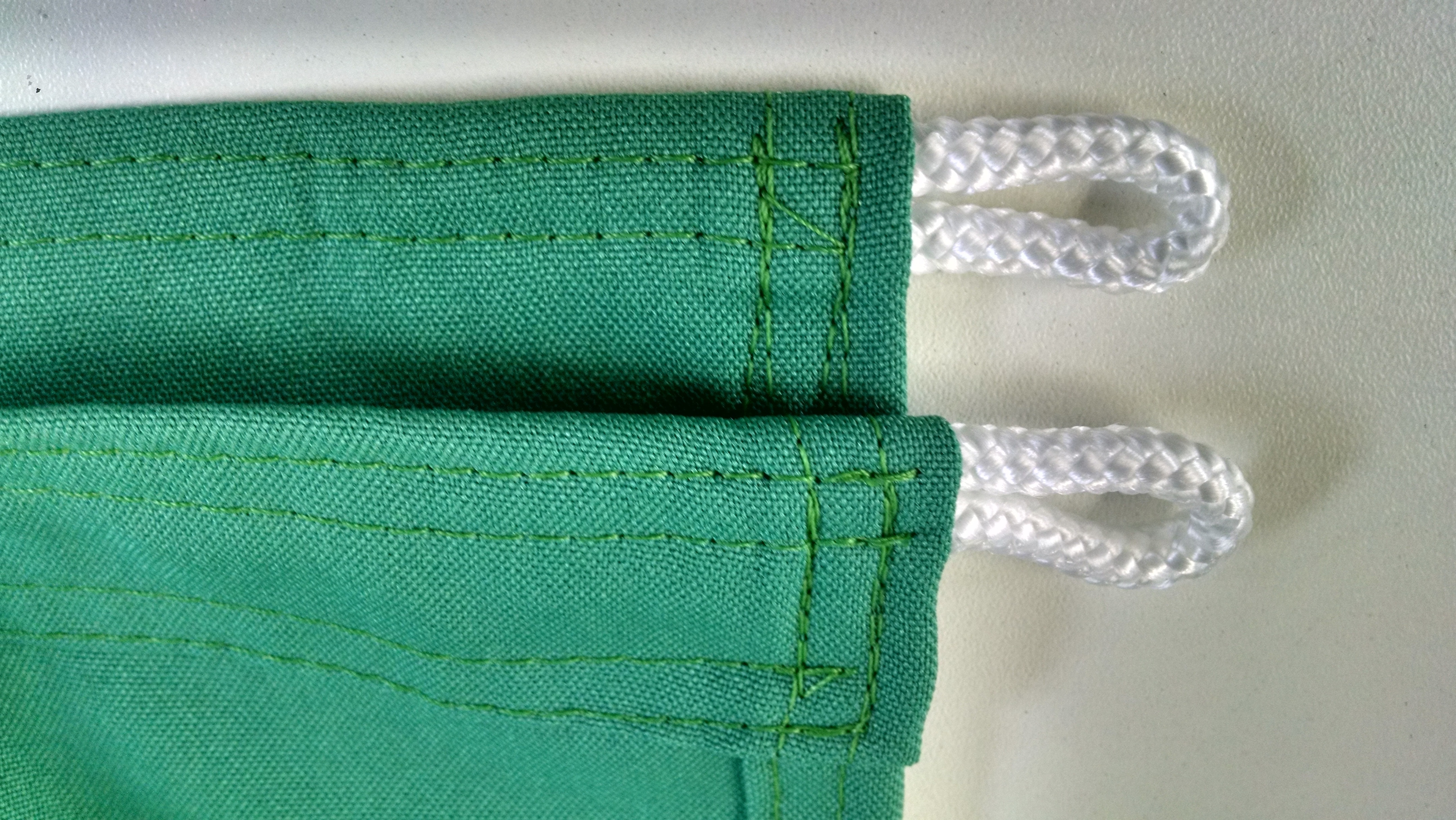 two green textile with handle