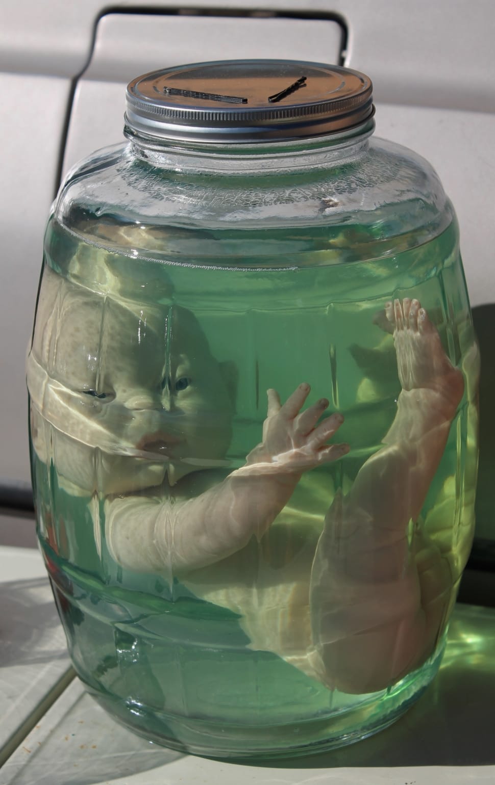 Halloween Doll, Haunted Doll, green color, human hand preview