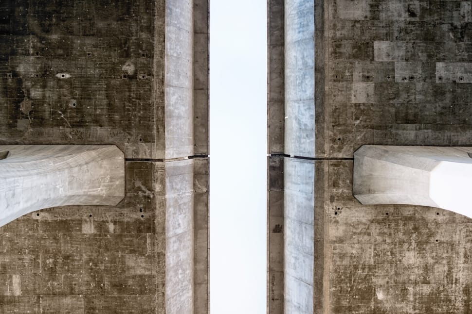 worm's eye view photography of brown concrete bridge preview