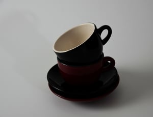 2 brown ceramic cups with saucers thumbnail