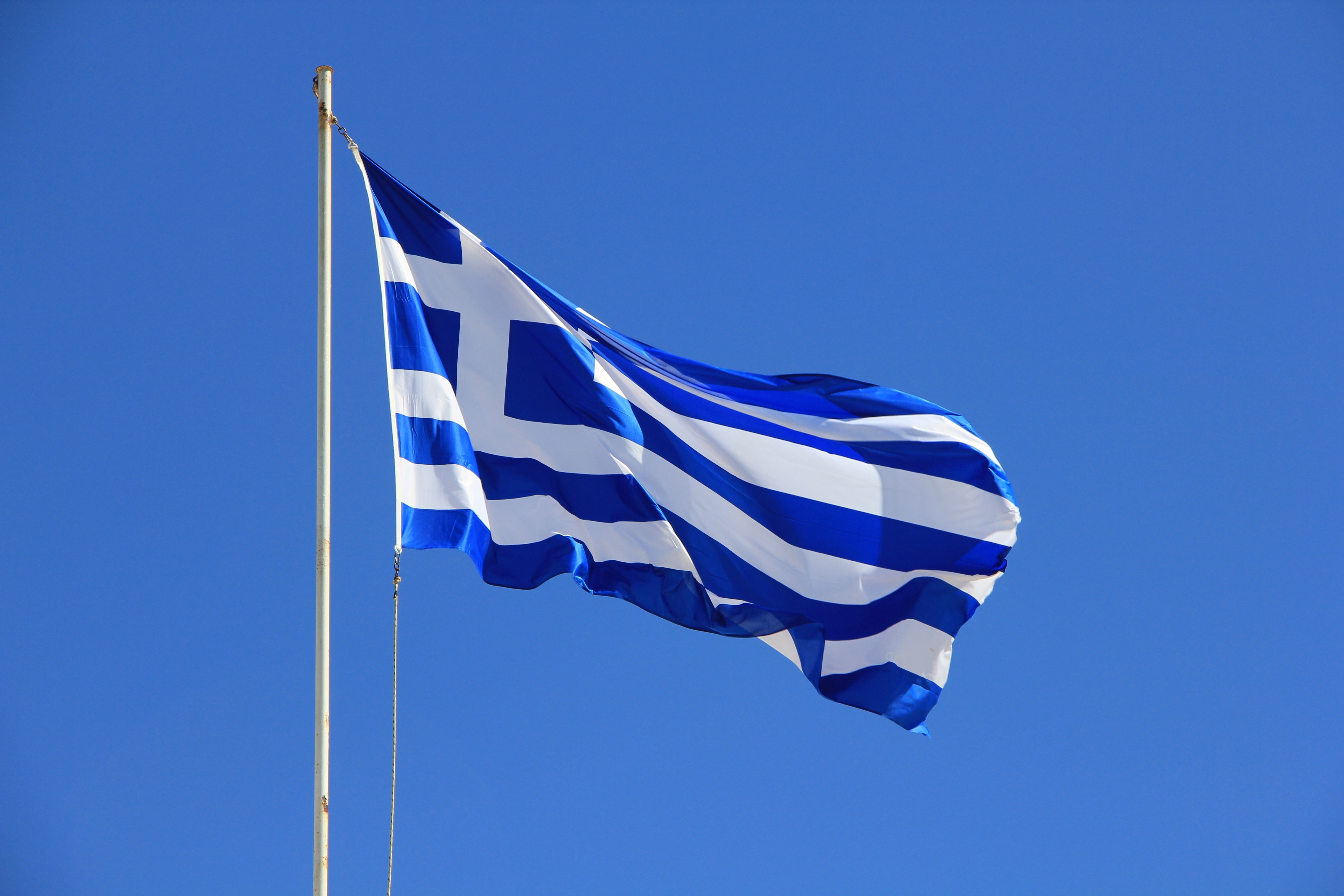 blue and white striped flag with cross