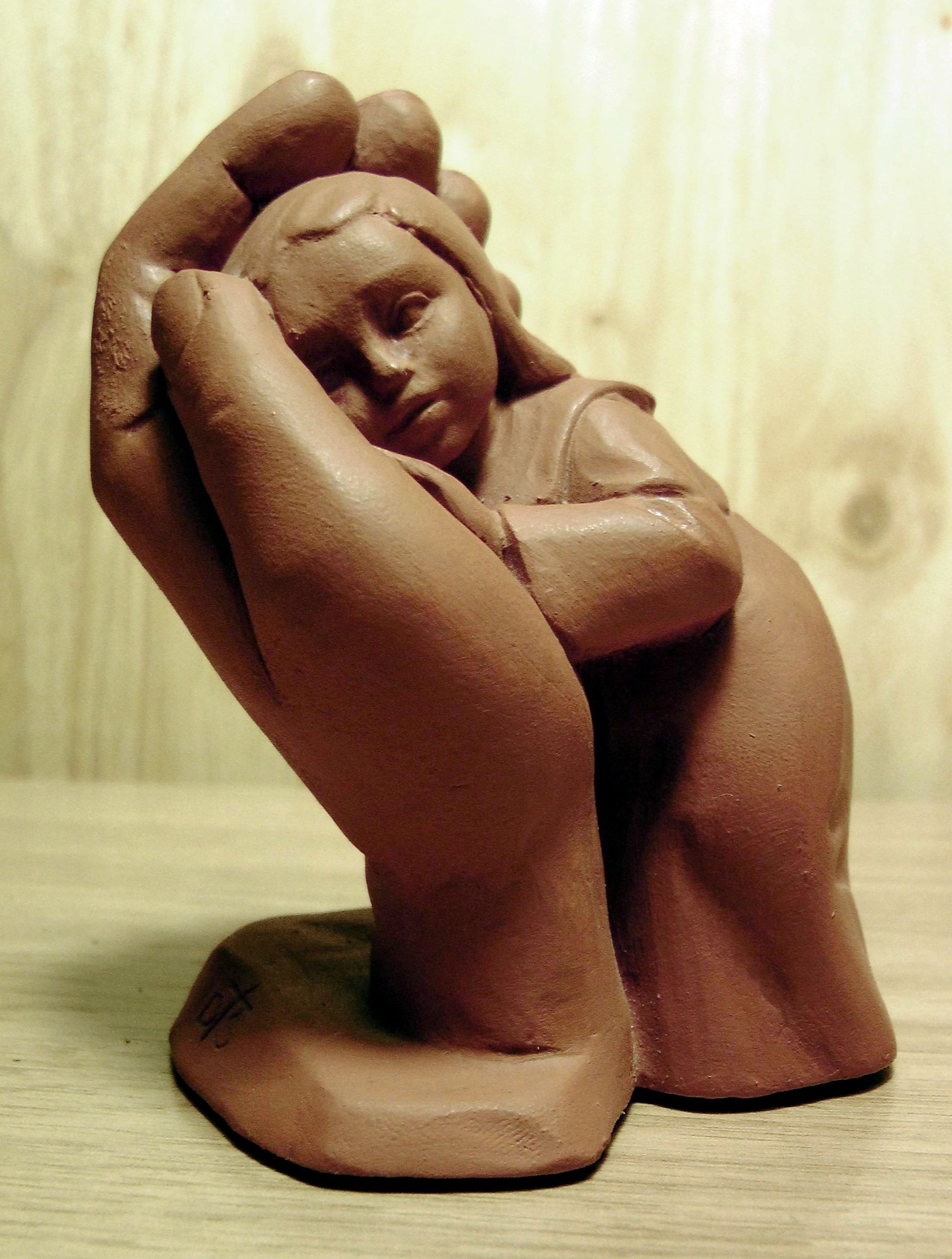 girl lying on hand ceramic figurine
