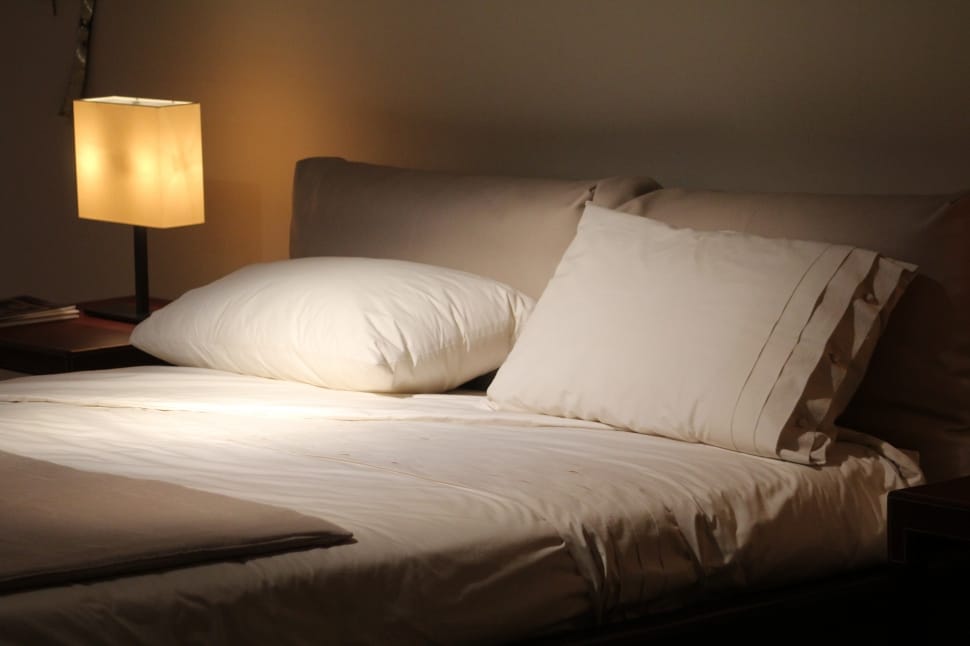 white bed linen and white pillow preview