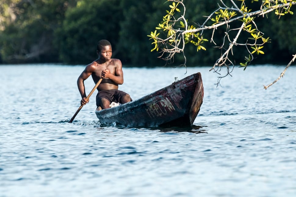 Silhouette Photo of Two Men Riding a Boat · Free Stock Photo