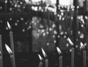gray scale photography of candles thumbnail