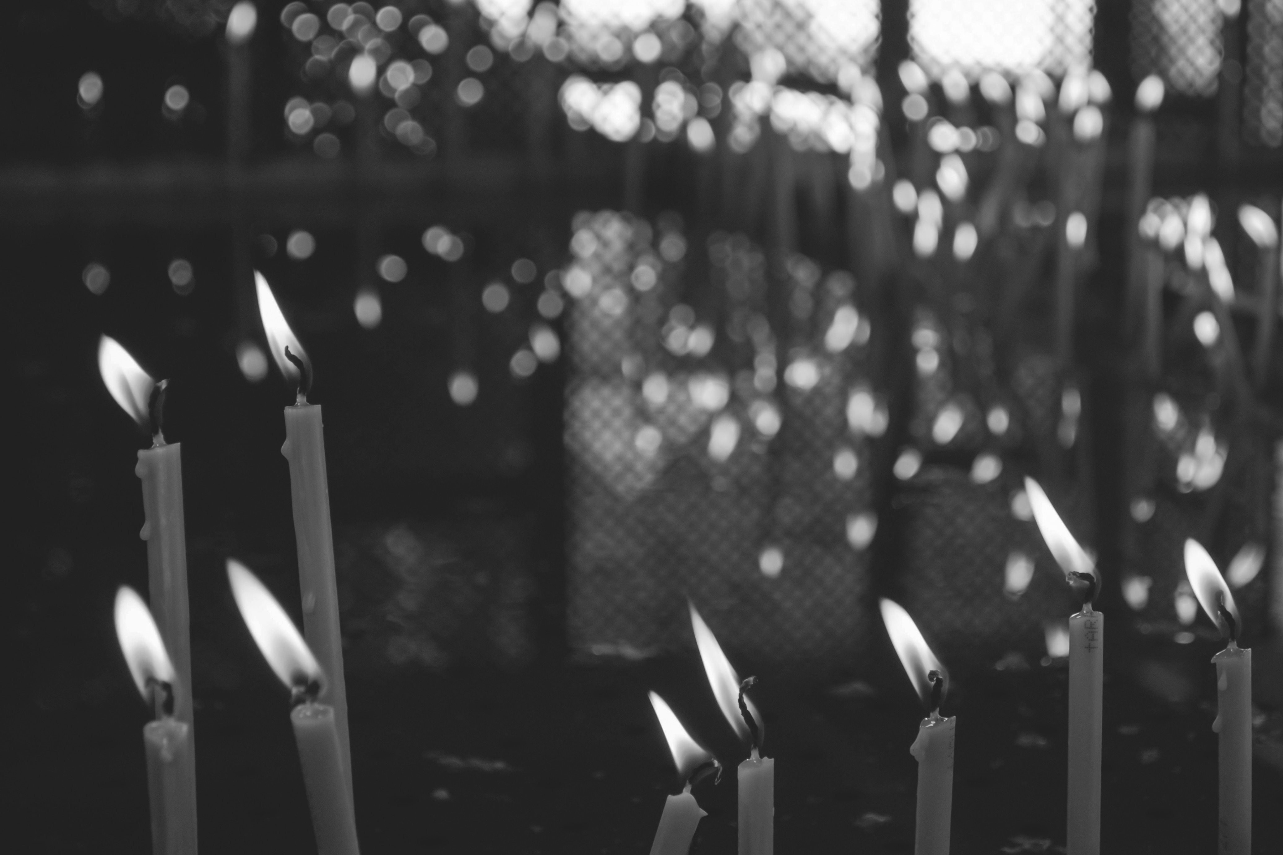 gray scale photography of candles