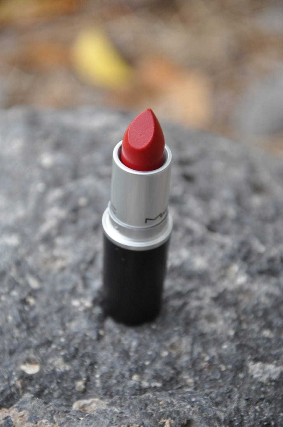 focus photography of red Mac lipstick preview