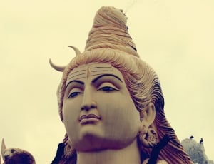 brown and white buddha statue thumbnail