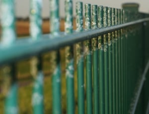 green metal fence thumbnail