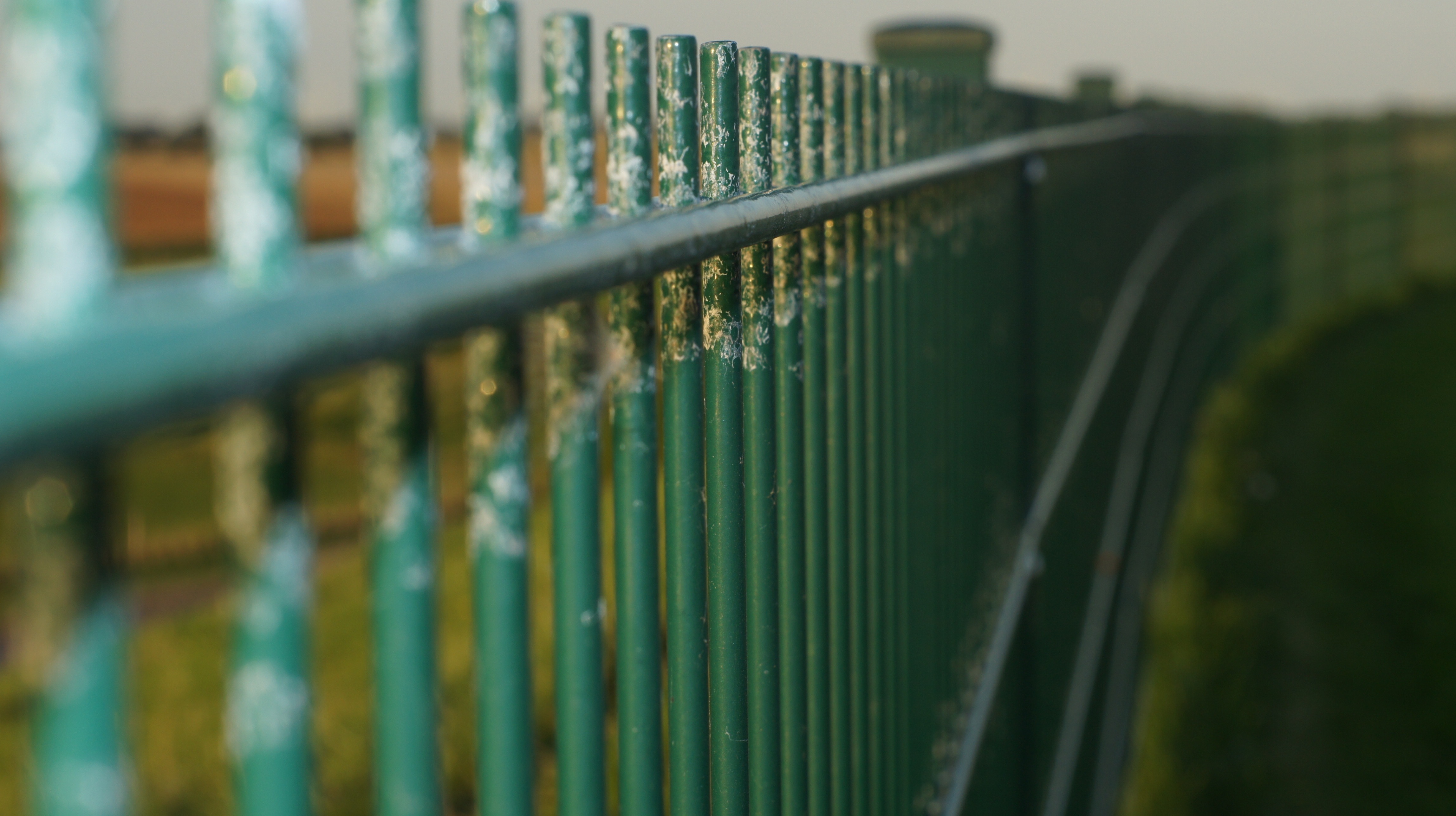 green metal fence