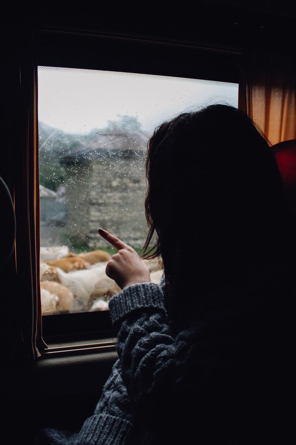 woman-in-grey-knit-sweater-staring-outside-the-window-wallpaper-preview.jpg